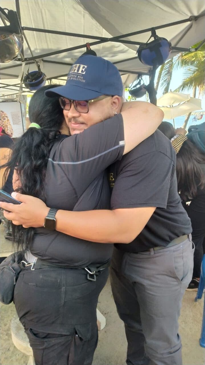 Two IHE team members embrace at the humanitarian response camp in La Guaira, Venezuela.